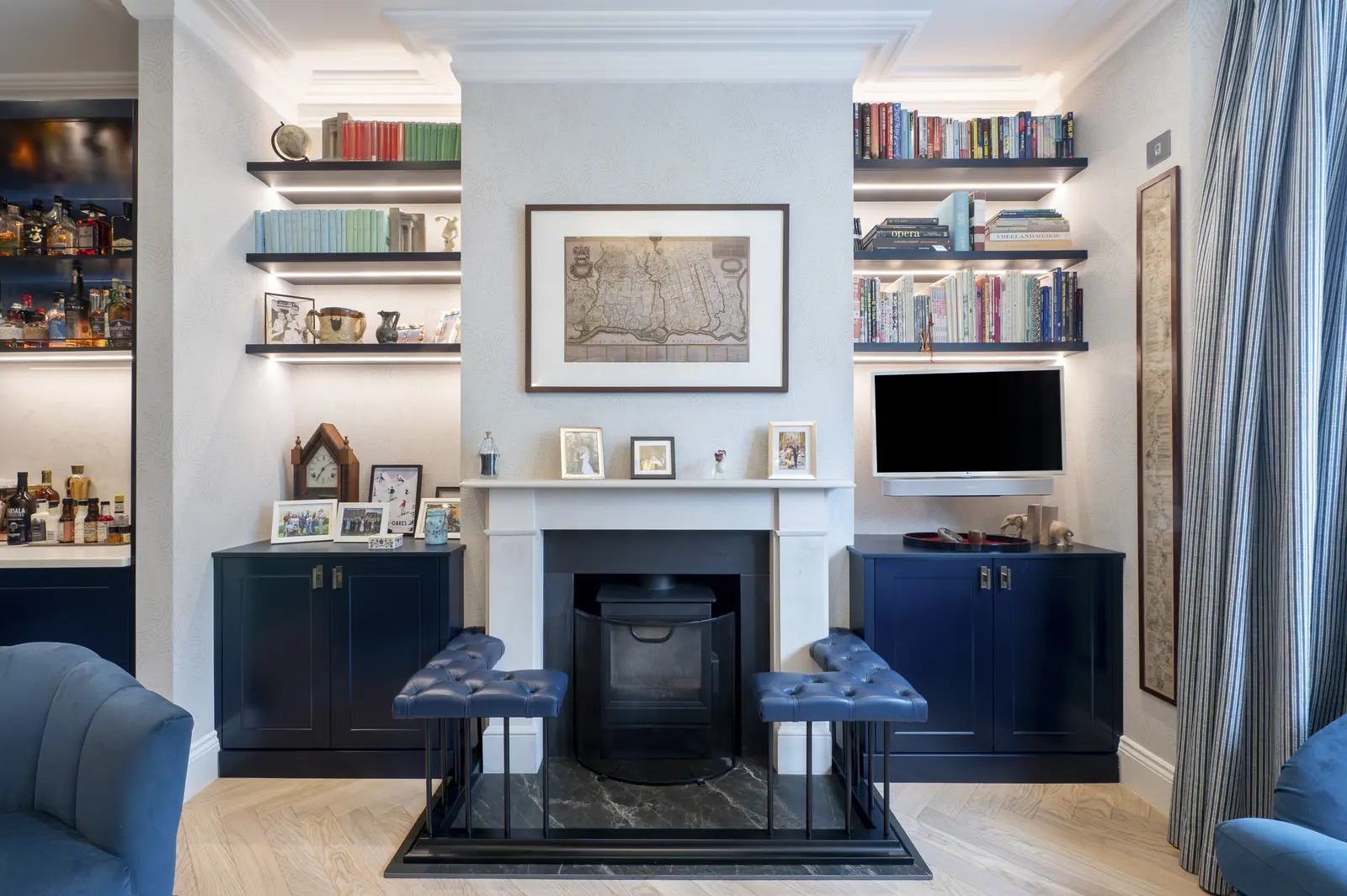 Alcove shelving and cupboards built either side of the original fireplace.