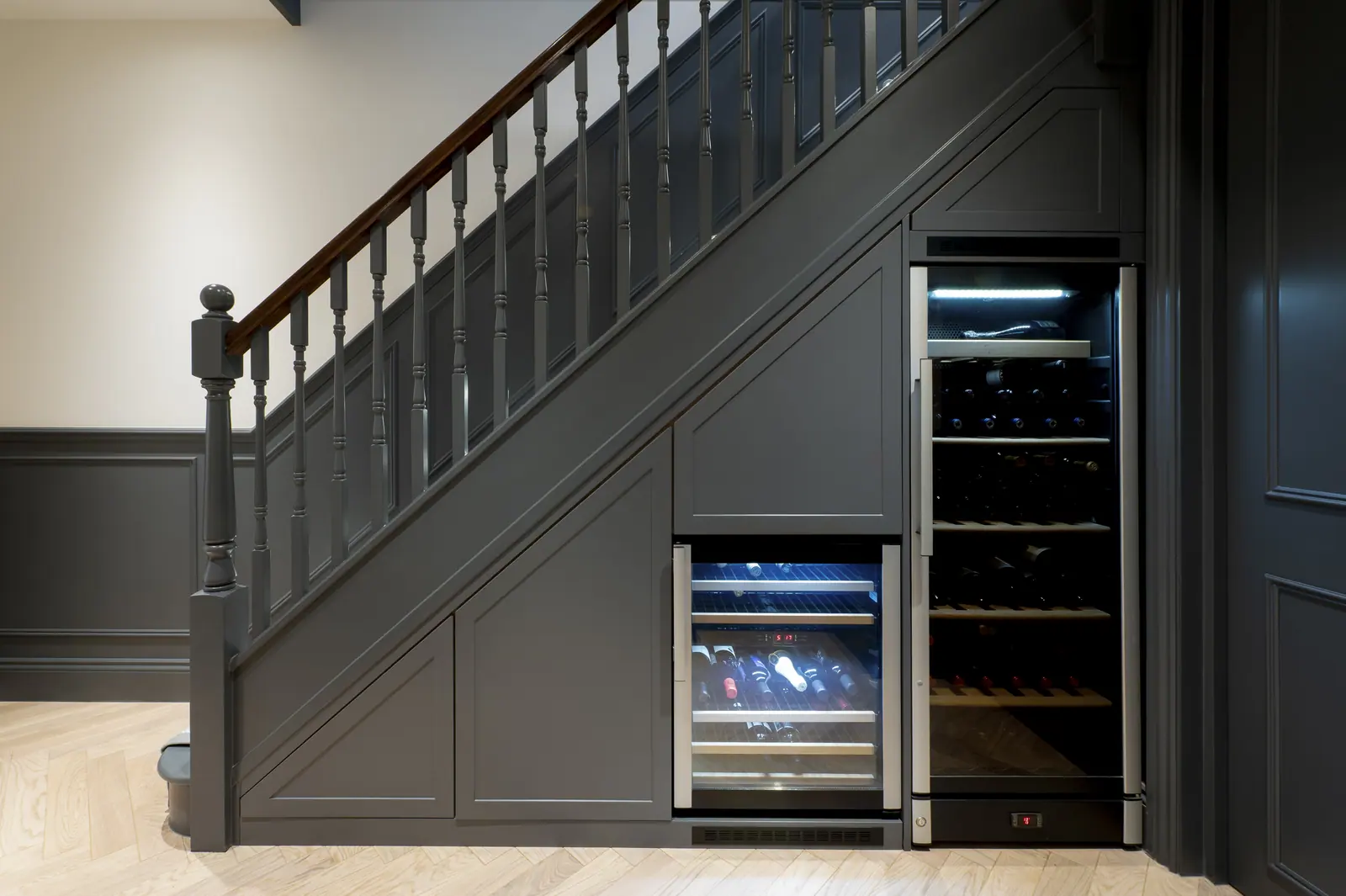 Wine storage built into the space under the stairs.