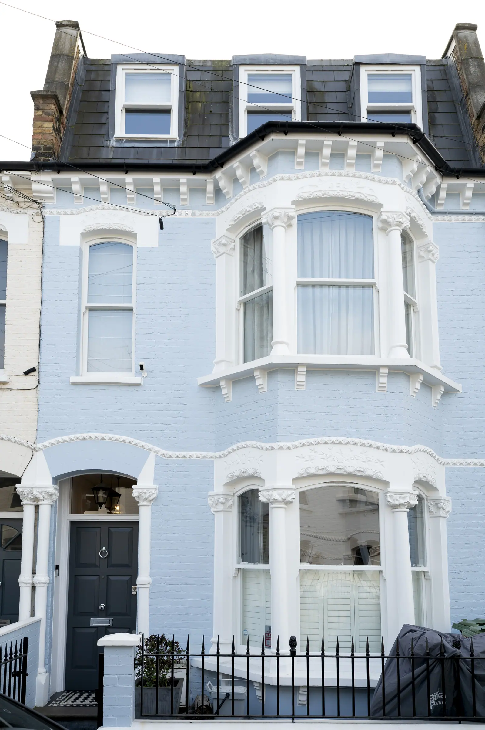 The four-storey Fulham town house, with its bay windows and original railings.